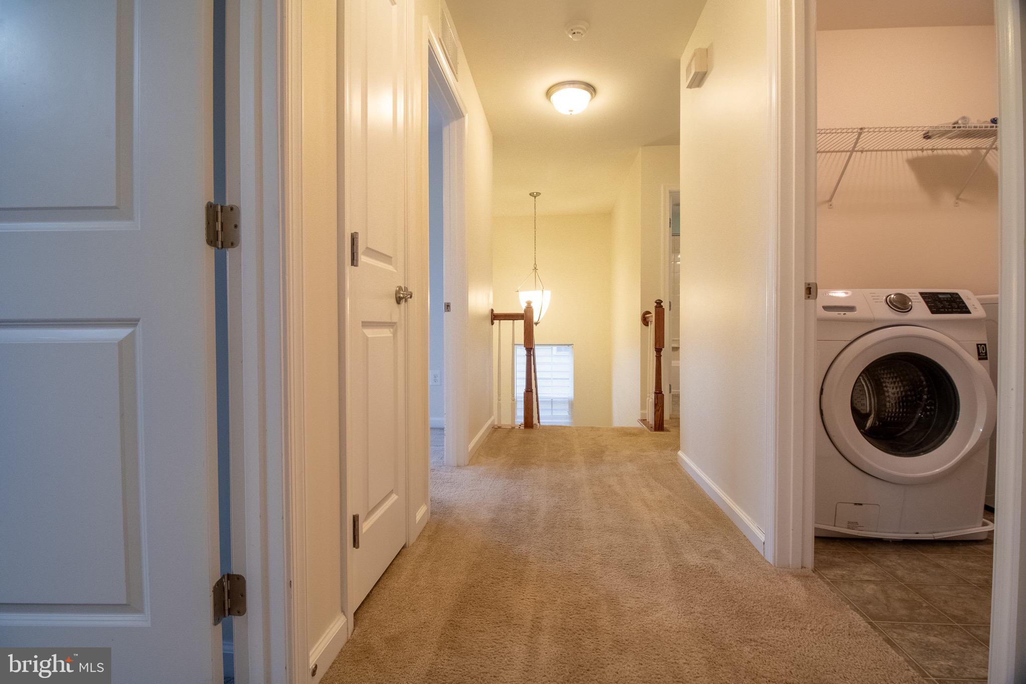 57 Tollerton Trail Falling Waters, WV 25419 - Photo 24 of 59 a view of a hallway with washer and dryer