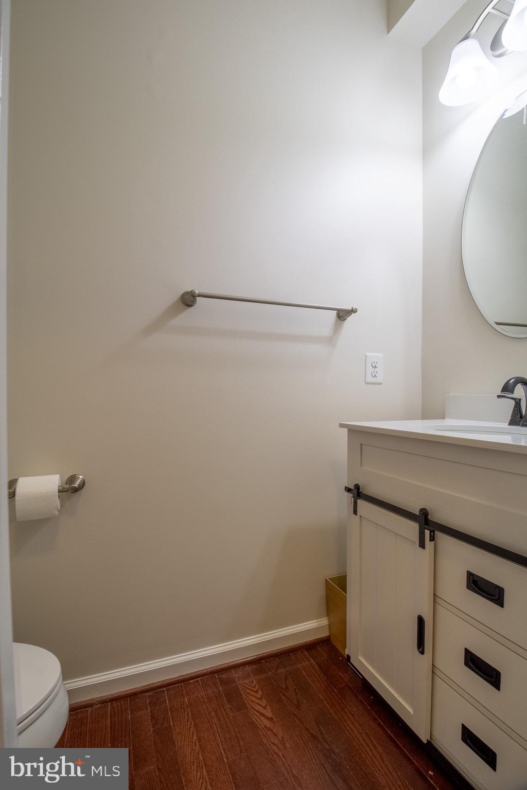 57 Tollerton Trail Falling Waters, WV 25419 - Photo 28 of 59 a bathroom with a sink a toilet and vanity