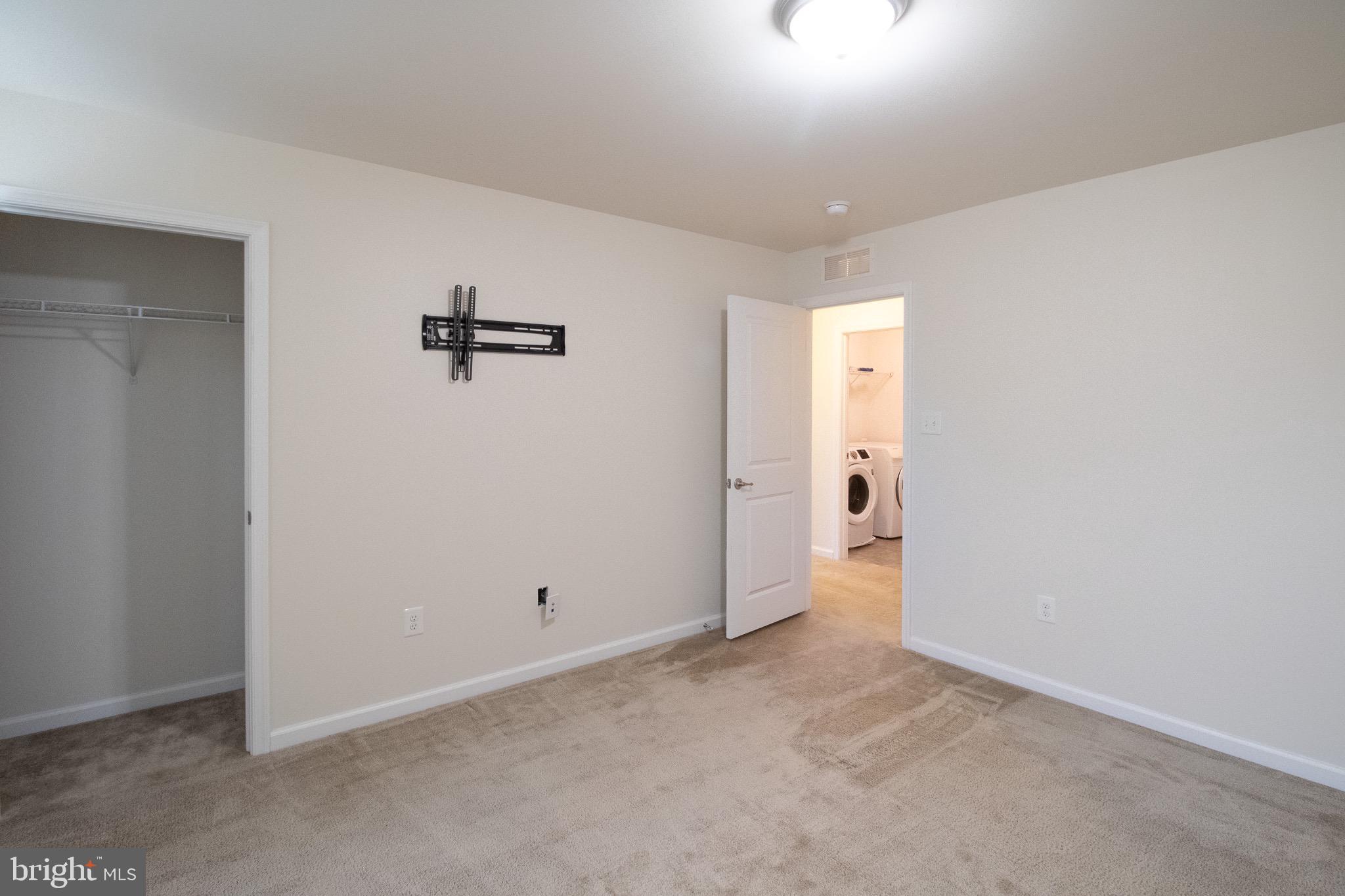 57 Tollerton Trail Falling Waters, WV 25419 - Photo 35 of 59 an empty room with an entryway and a hallway