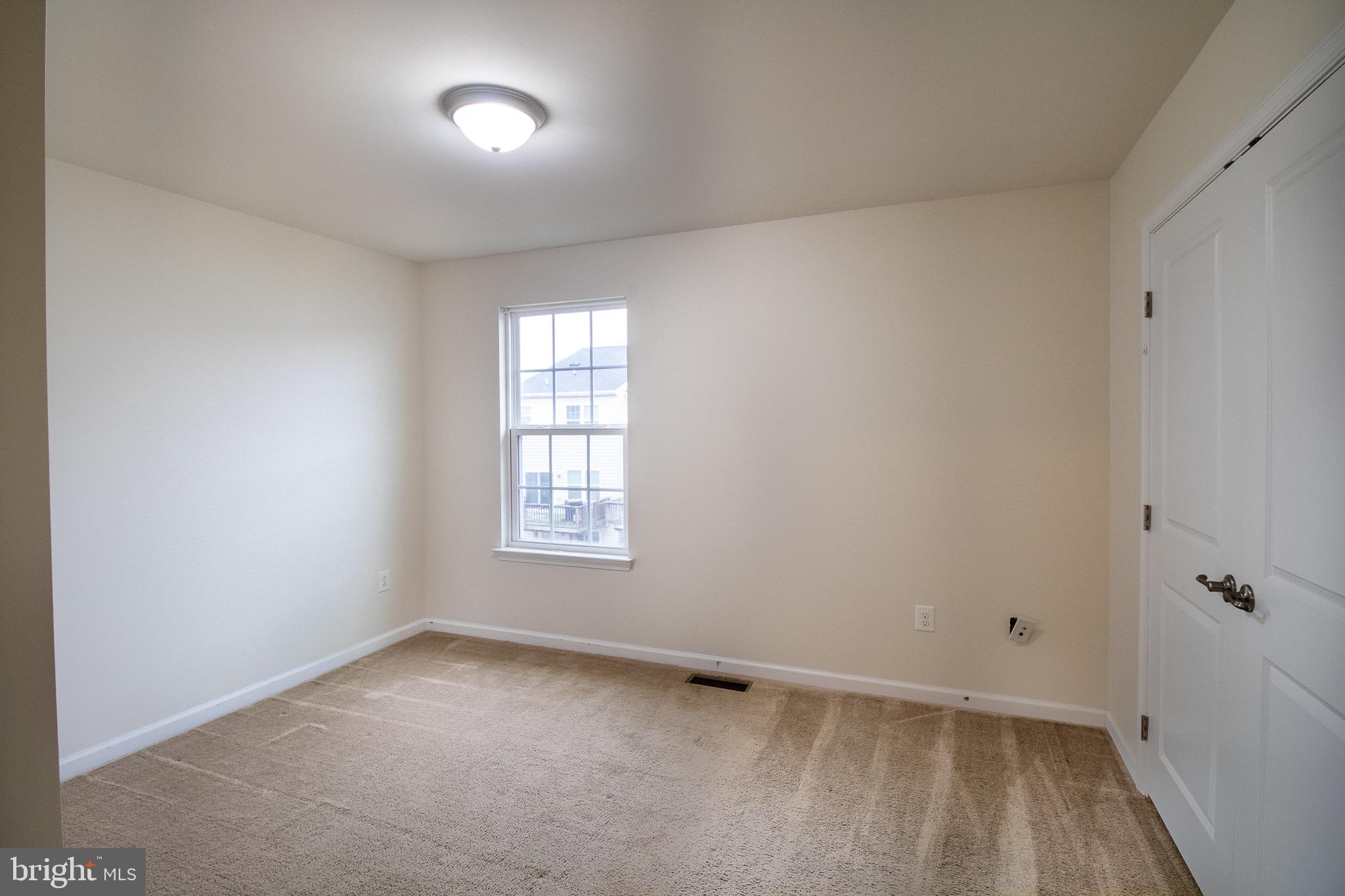 57 Tollerton Trail Falling Waters, WV 25419 - Photo 39 of 59 a view of an empty room with a window