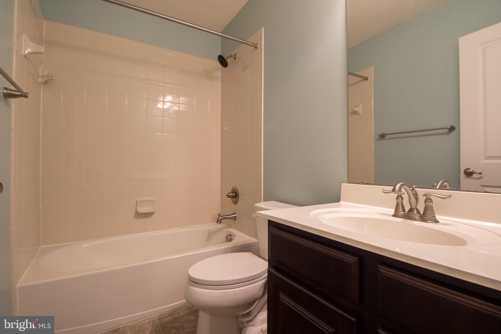 57 Tollerton Trail Falling Waters, WV 25419 - Photo 42 of 59 a bathroom with a sink a toilet and shower