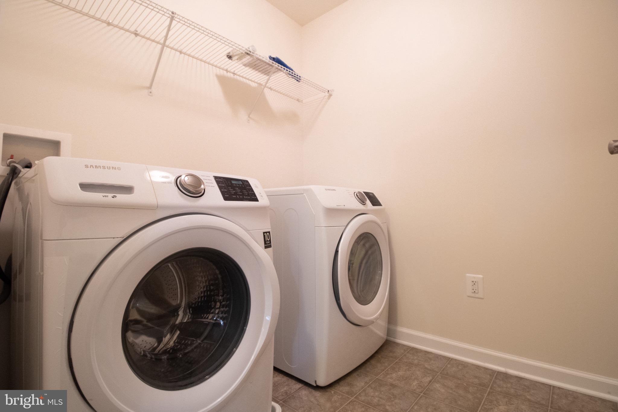 57 Tollerton Trail Falling Waters, WV 25419 - Photo 43 of 59 a utility room with dryer and washer