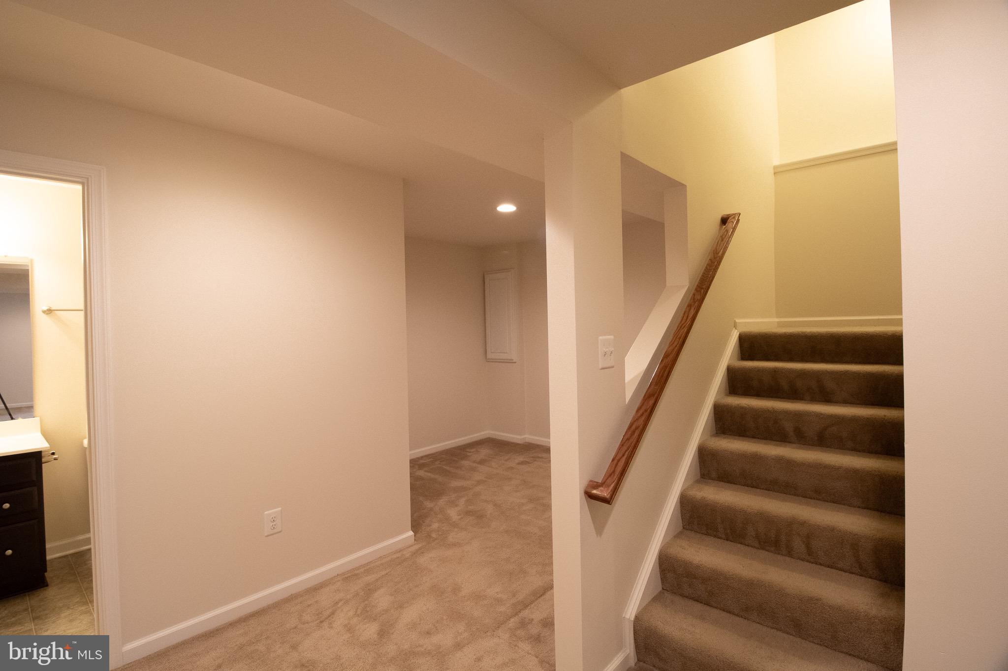 57 Tollerton Trail Falling Waters, WV 25419 - Photo 45 of 59 a view of staircase with white walls