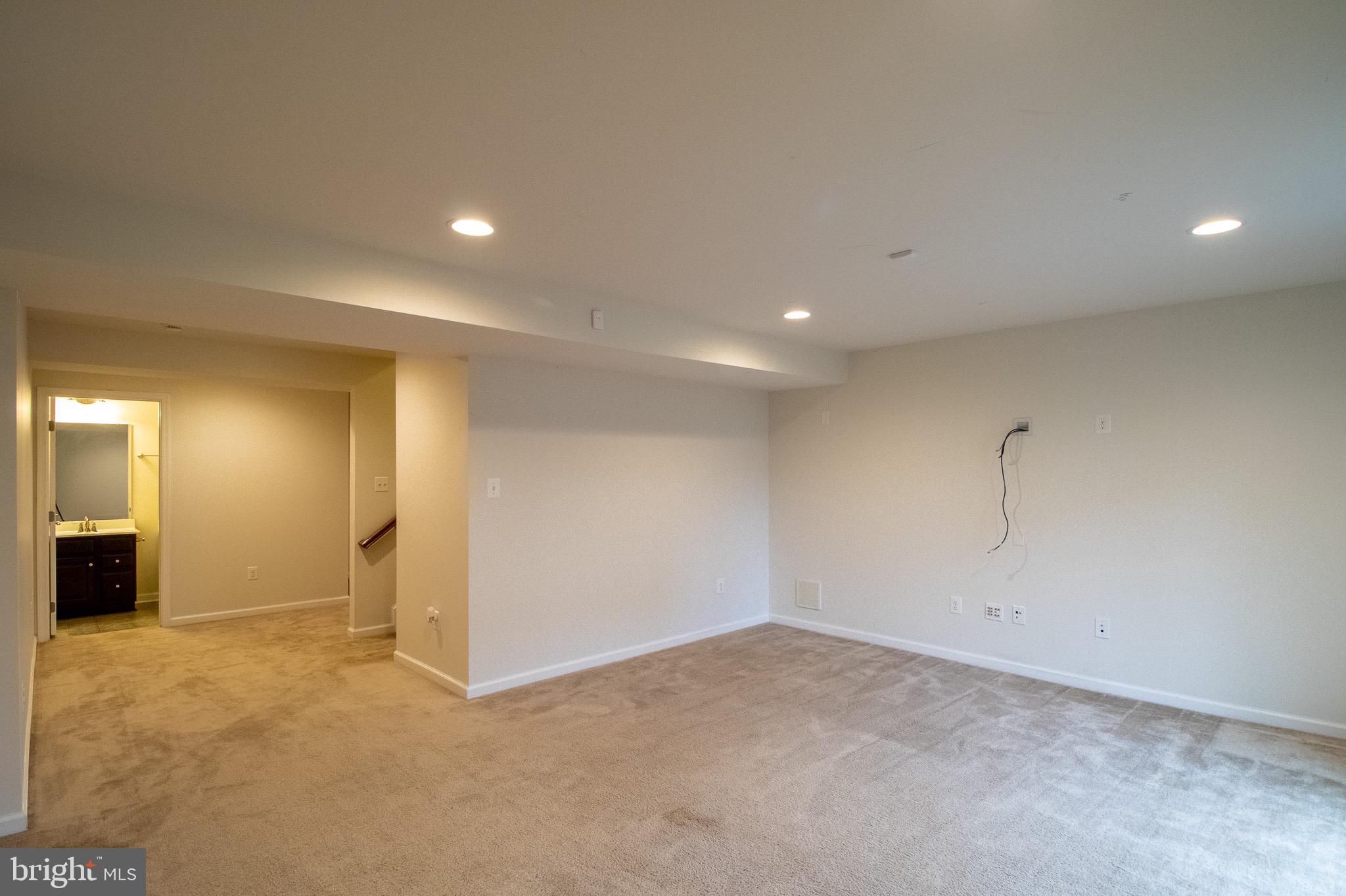 57 Tollerton Trail Falling Waters, WV 25419 - Photo 48 of 59 an empty room with a bathroom and mirror