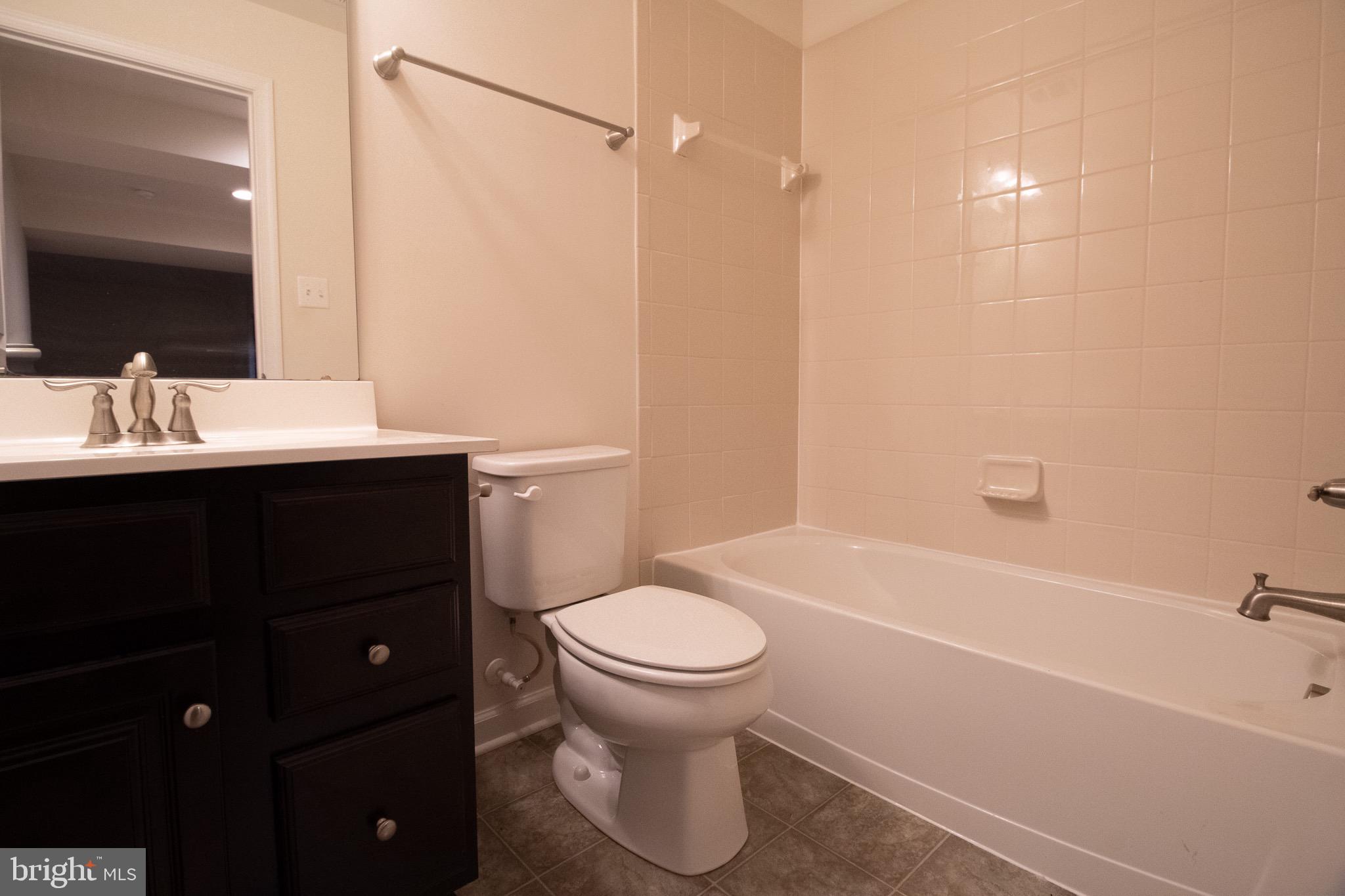 57 Tollerton Trail Falling Waters, WV 25419 - Photo 49 of 59 a bathroom with a sink a toilet and shower