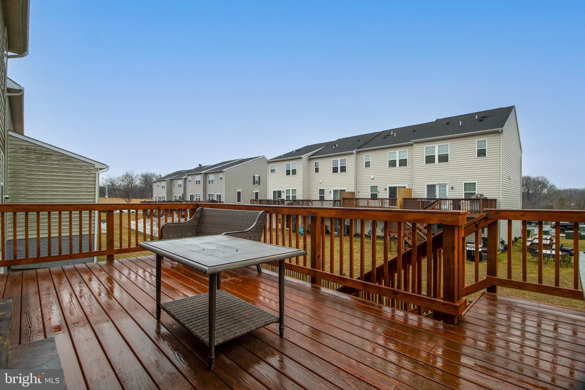 57 Tollerton Trail Falling Waters, WV 25419 - Photo 54 of 59 a view of a balcony with wooden floor and fence