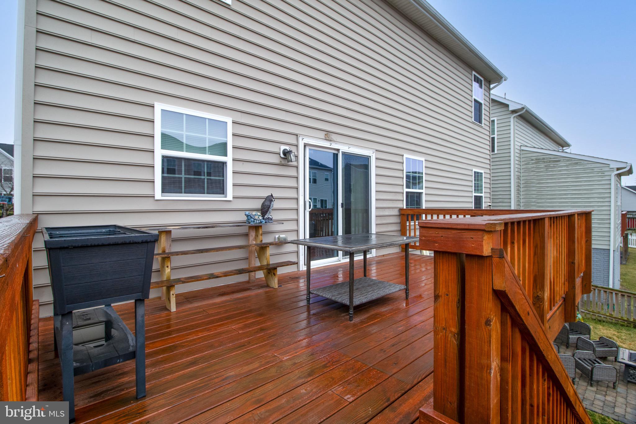57 Tollerton Trail Falling Waters, WV 25419 - Photo 55 of 59 a backyard of a house with seating space