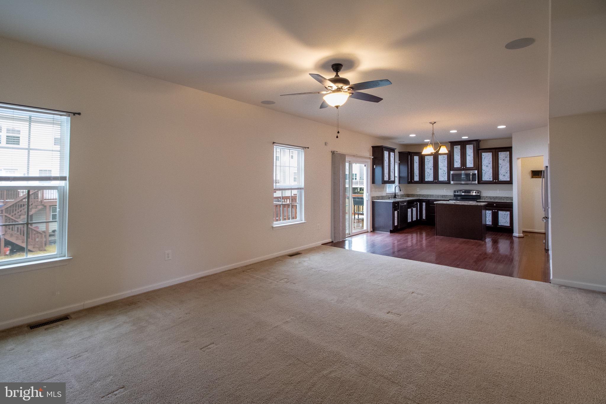 57 Tollerton Trail Falling Waters, WV 25419 - Photo 8 of 59 a view of a livingroom with furniture and chandelier fan