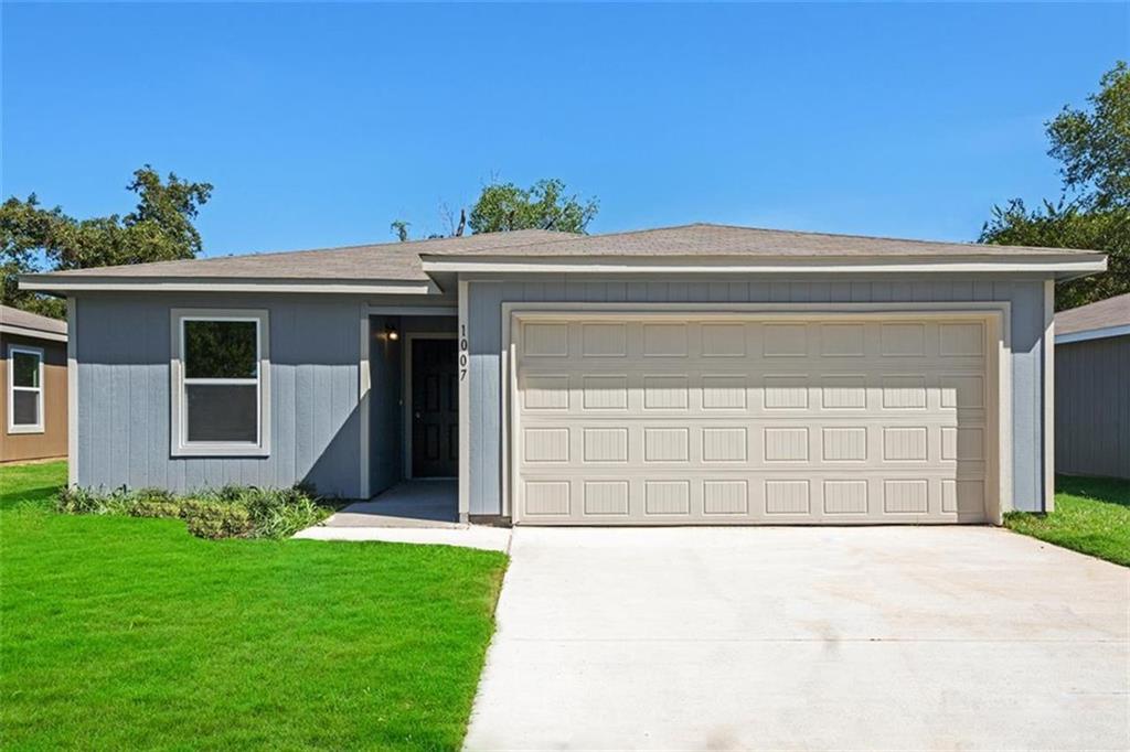 1007 Dawson Street Waco, TX 76704 - Photo 1 of 1 a front view of a house with a yard