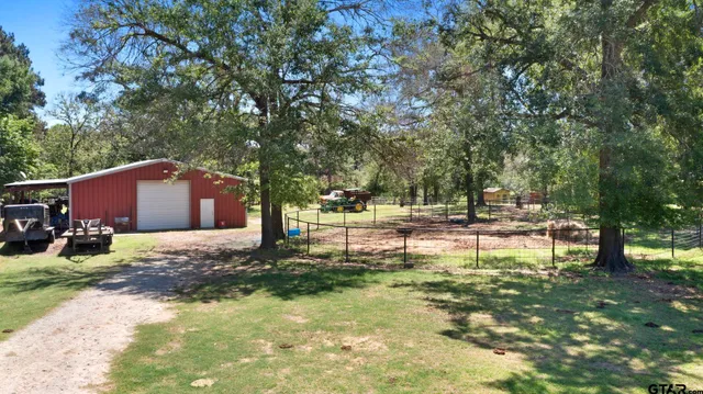 a view of a tree in front of a house
