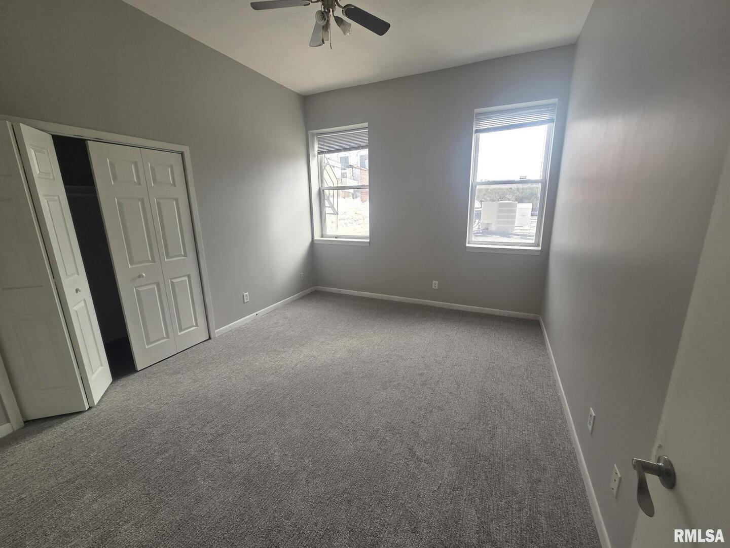 1706 2nd Street Rock Island, IL 61201 - Photo 7 of 9 an empty room with windows and entrance