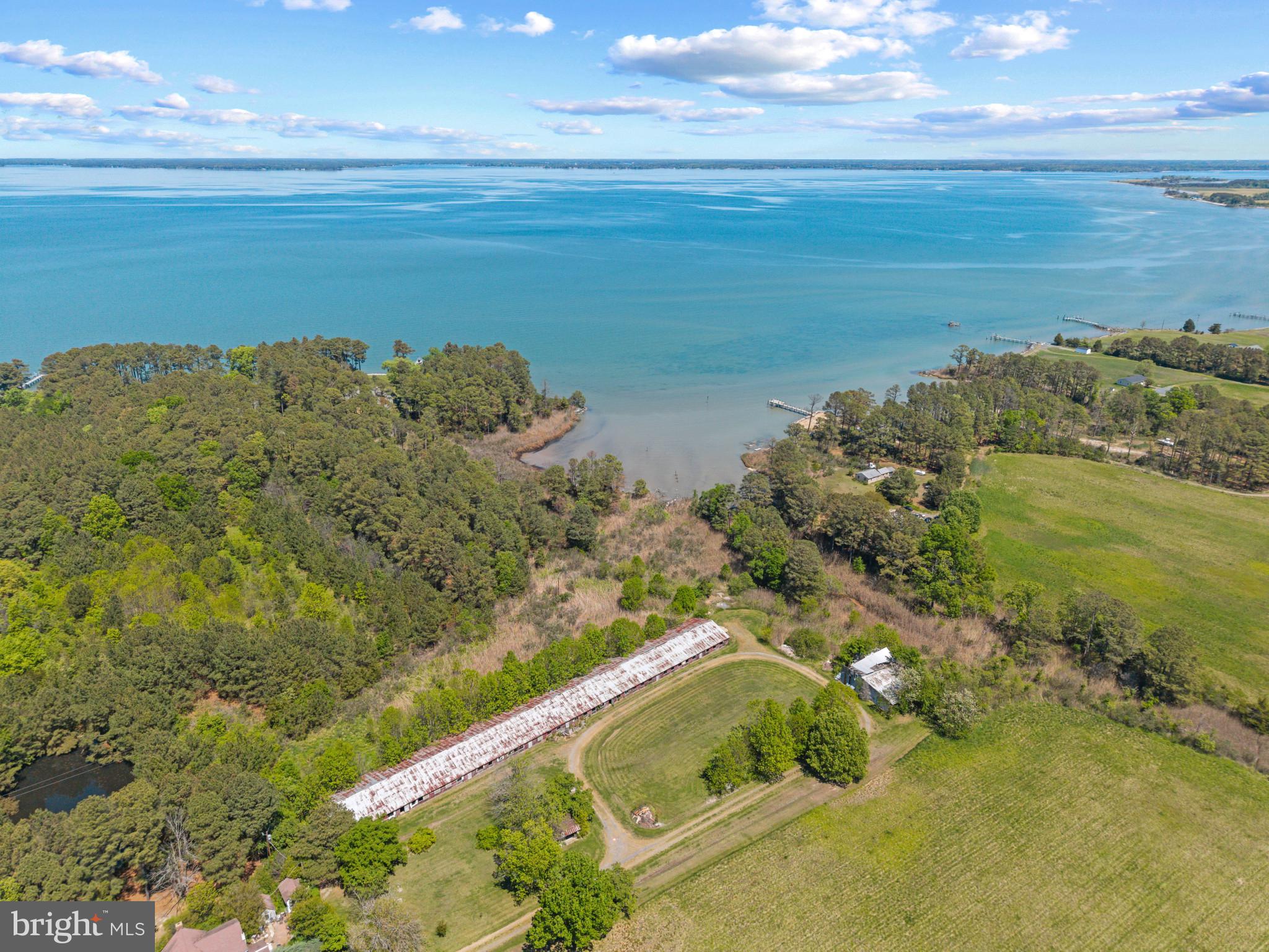 6033 Corners Wharf Road Cambridge, MD 21613 - Photo 6 of 11 a view of a lake with a mountain