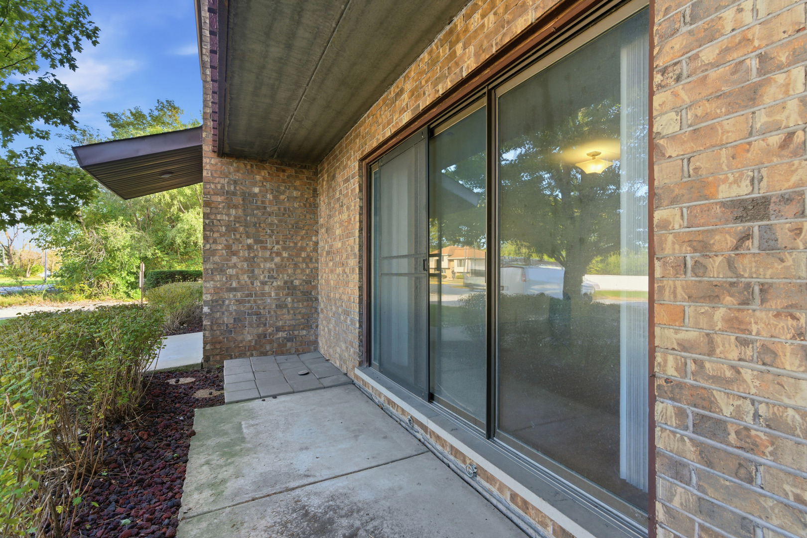 a view of a glass door of the house