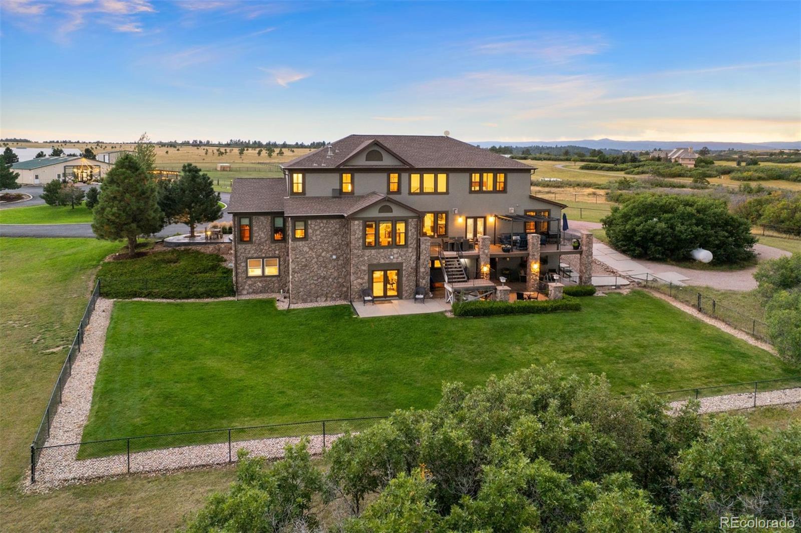 2940 Canon Ridge Road Castle Rock, CO 80104 - Photo 20 of 49 an aerial view of a chairs and table on the wooden deck