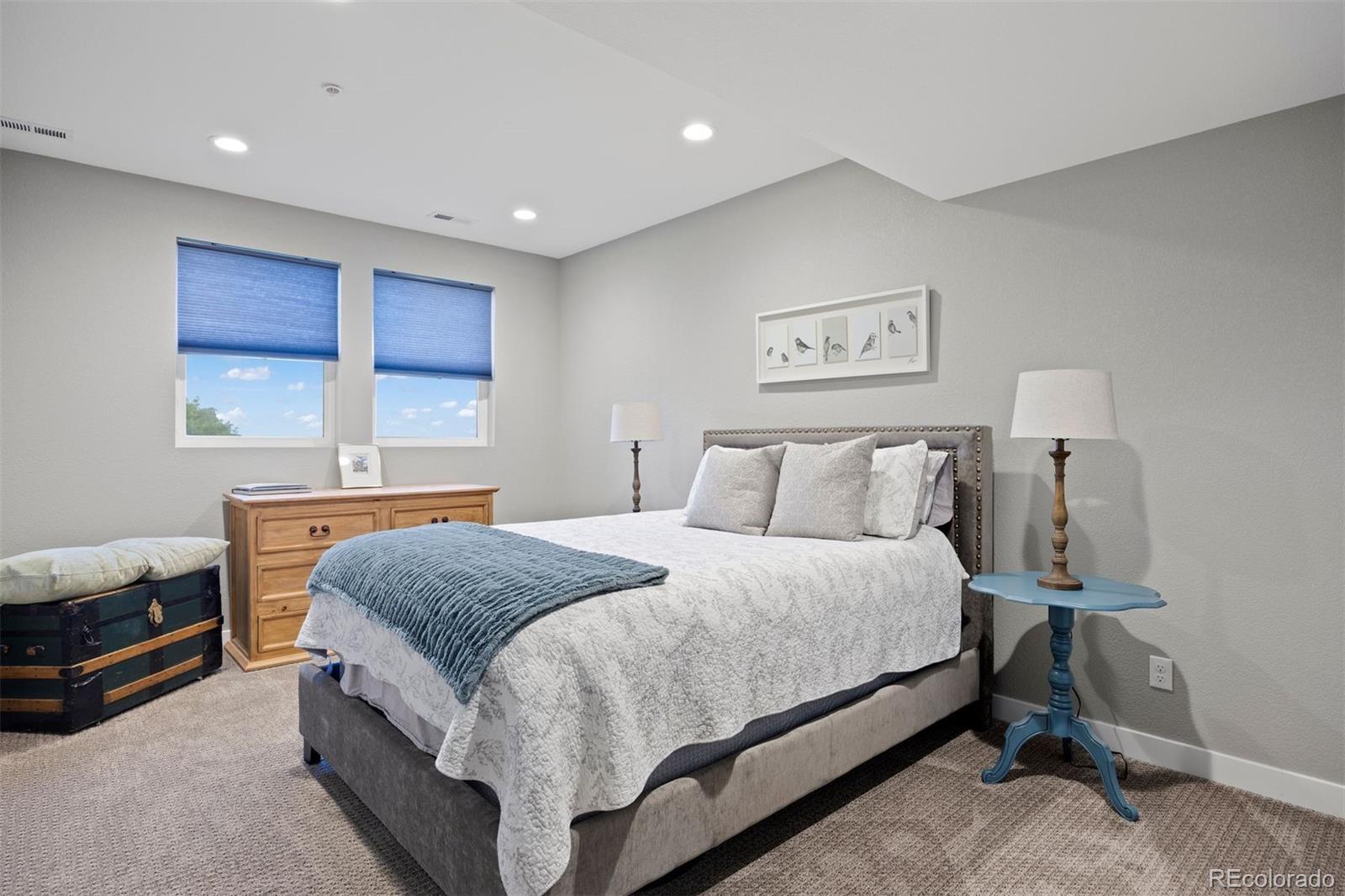 2940 Canon Ridge Road Castle Rock, CO 80104 - Photo 28 of 49 a spacious bedroom with a bed and window