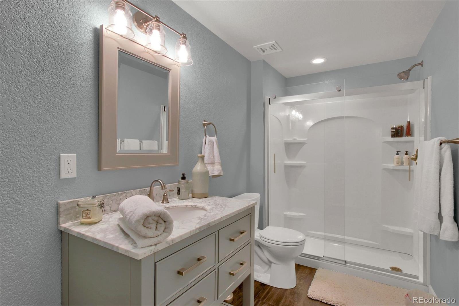 2940 Canon Ridge Road Castle Rock, CO 80104 - Photo 29 of 49 a bathroom with a sink toilet double vanity and shower