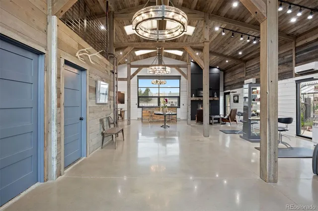 a view of a porch with furniture and garden