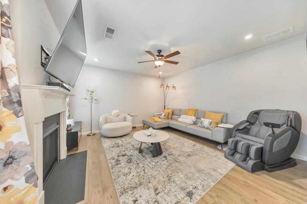 3146 Dowsing Lane Powder Springs, GA 30127 - Photo 13 of 42 a living room with furniture and a fireplace
