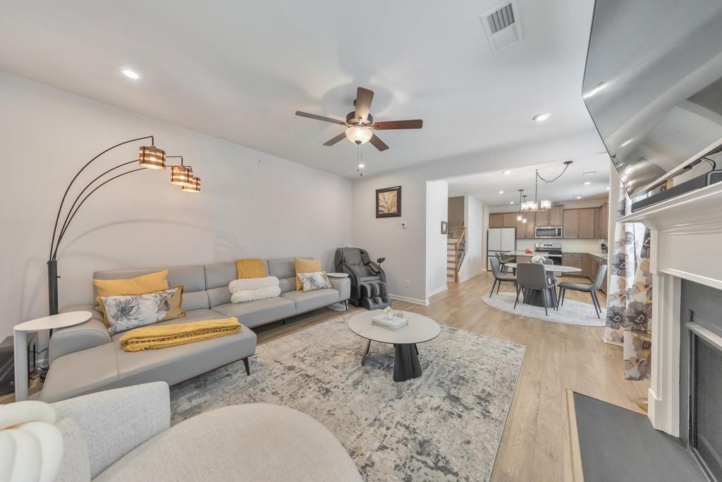 3146 Dowsing Lane Powder Springs, GA 30127 - Photo 14 of 42 a living room with furniture and a chandelier