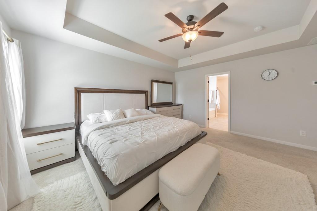 3146 Dowsing Lane Powder Springs, GA 30127 - Photo 19 of 42 a bedroom with a bed and window