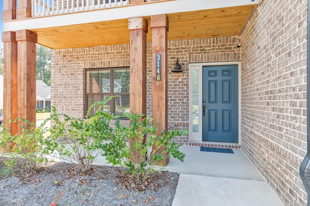3146 Dowsing Lane Powder Springs, GA 30127 - Photo 2 of 42 a view of a brick house with potted plants