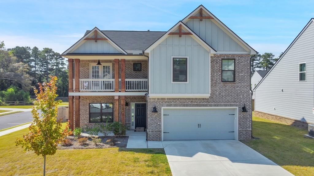 3146 Dowsing Lane Powder Springs, GA 30127 - Photo 40 of 42 a front view of a house with a yard