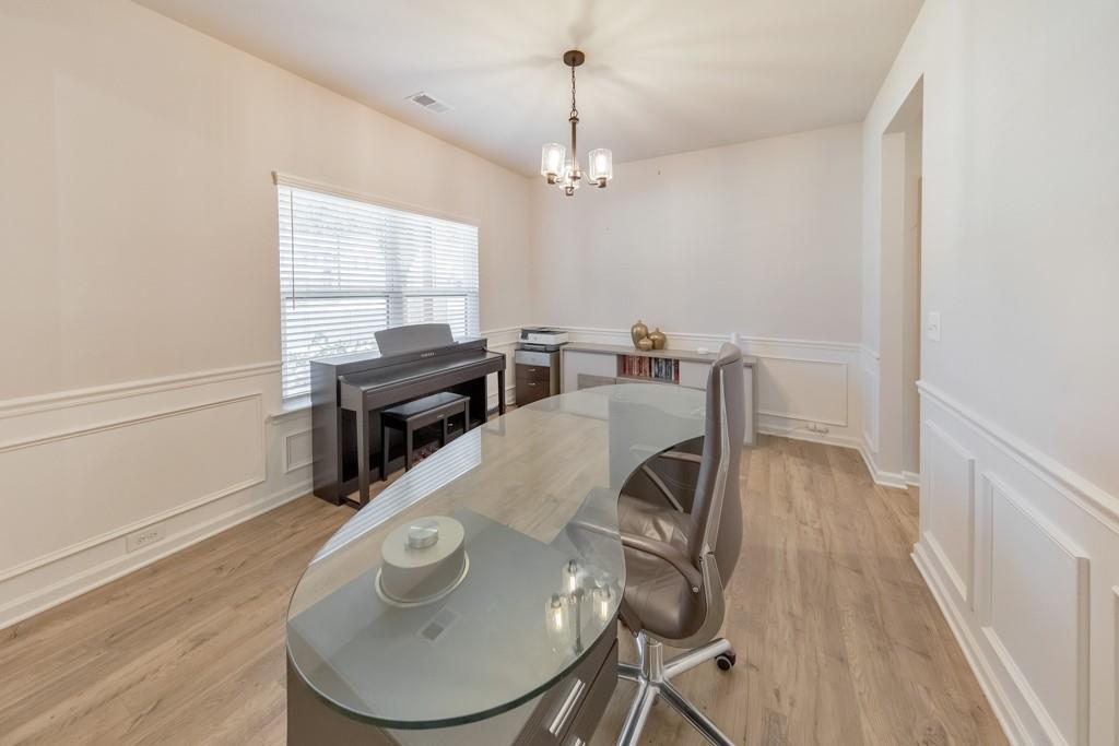 3146 Dowsing Lane Powder Springs, GA 30127 - Photo 5 of 42 a view of a dining room with furniture window and wooden floor