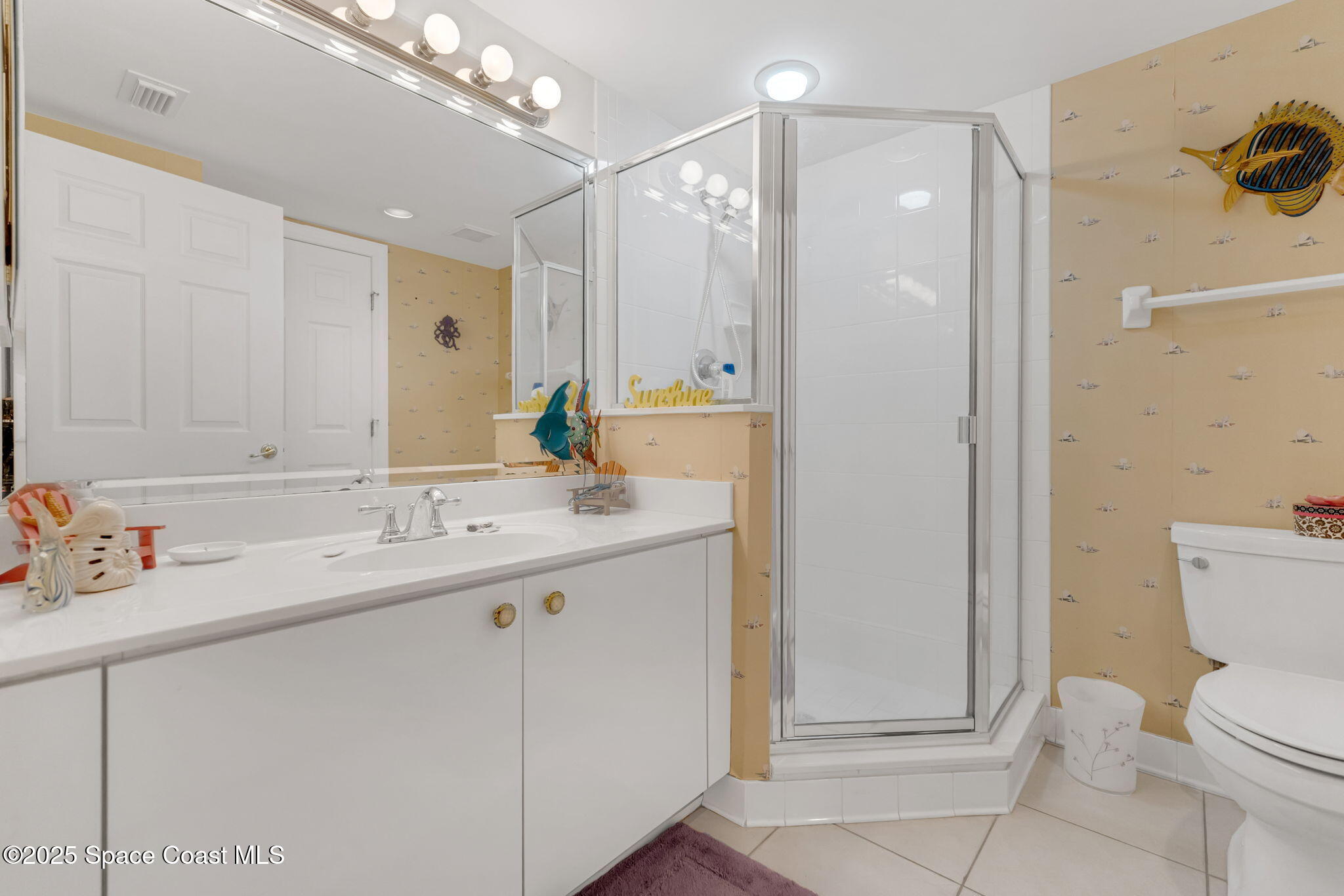 4631 South Atlantic Avenue, Unit 8102 Port Orange, FL 32127 - Photo 21 of 27 a bathroom with a sink a toilet and shower