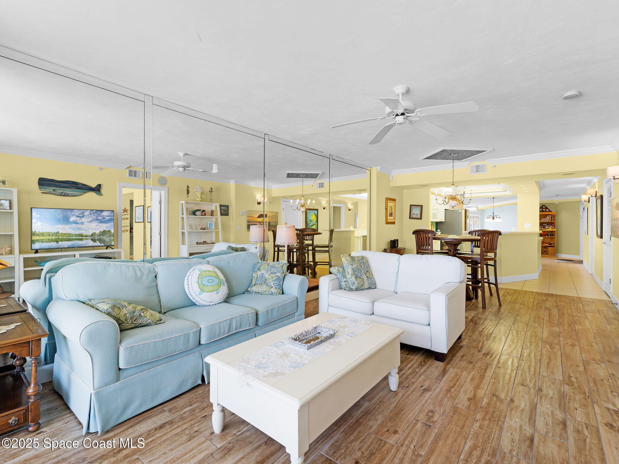 4631 South Atlantic Avenue, Unit 8102 Port Orange, FL 32127 - Photo 6 of 27 a living room with furniture and a large window