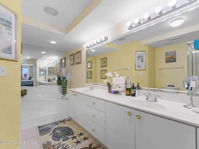 a bedroom with a bed and ceiling fan