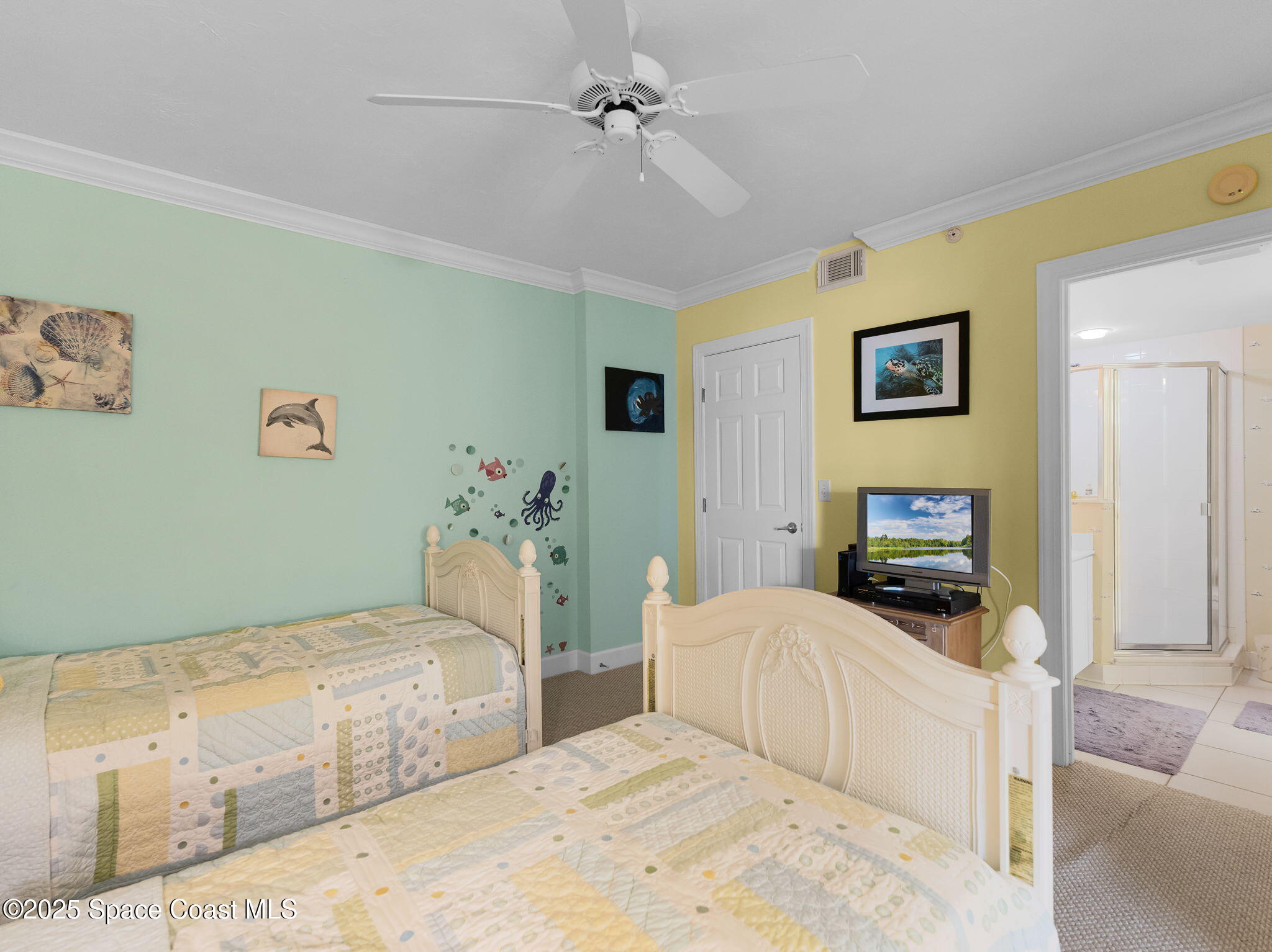 4631 South Atlantic Avenue, Unit 8102 Port Orange, FL 32127 - Photo 10 of 27 a bedroom with a bed and a couch
