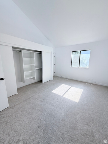 227 South West Lane Provo, UT 84601 - Photo 11 of 25 Interior room featuring a vaulted ceiling and light gray carpeting