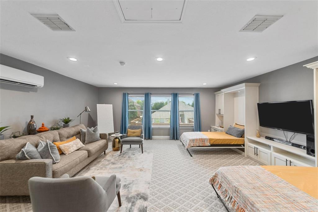 1551 Crystal Pass Allen, TX 75002 - Photo 11 of 27 a living room with furniture and a flat screen tv