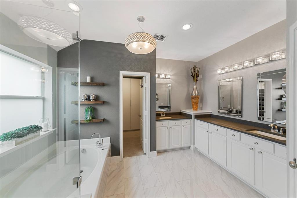 1551 Crystal Pass Allen, TX 75002 - Photo 15 of 27 a large kitchen with stainless steel appliances a refrigerator and a sink