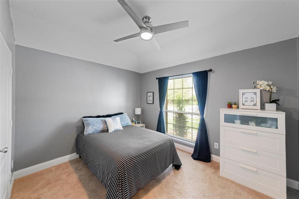 1551 Crystal Pass Allen, TX 75002 - Photo 19 of 27 a bedroom with a bed and a window