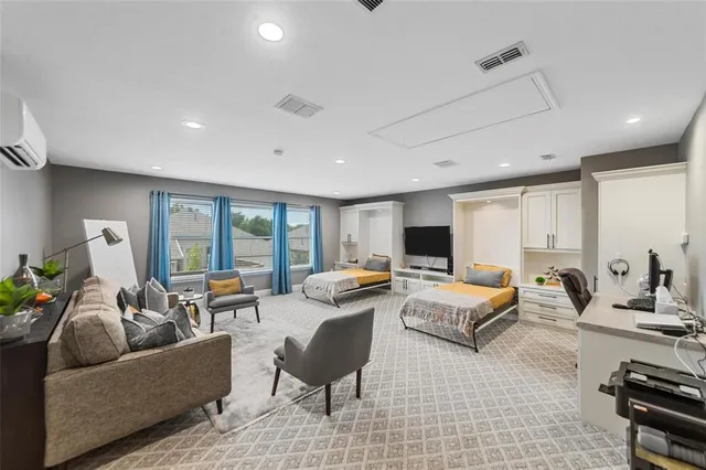 a living room with furniture and large windows