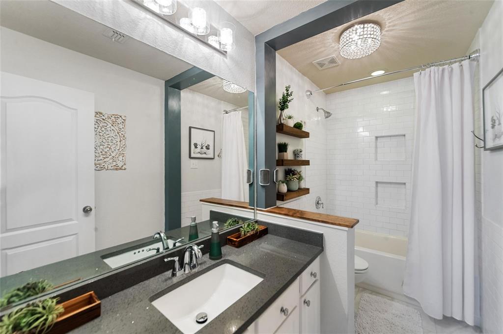 1551 Crystal Pass Allen, TX 75002 - Photo 22 of 27 a room with gym equipment and a large mirror