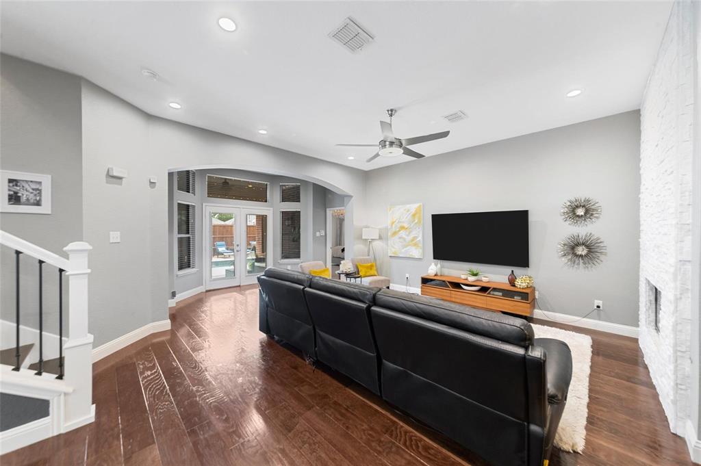 1551 Crystal Pass Allen, TX 75002 - Photo 7 of 27 a living room with furniture and a flat screen tv