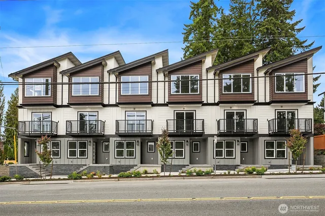 a front view of residential houses and street