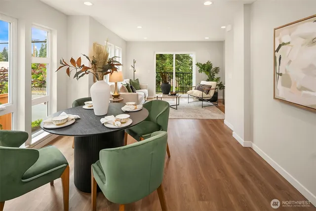 a view of a dining room with furniture window and wooden floor
