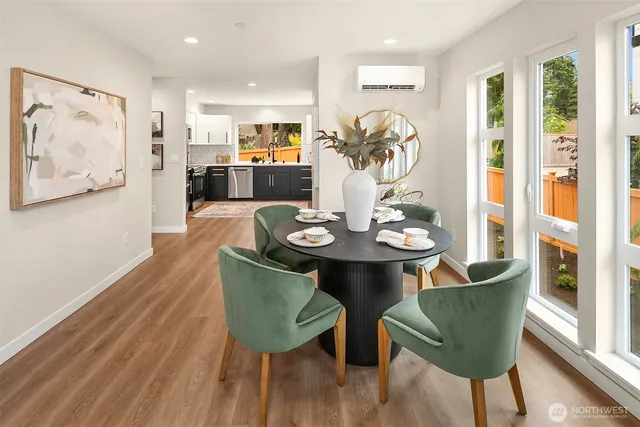 a view of a dining room with furniture and wooden floor