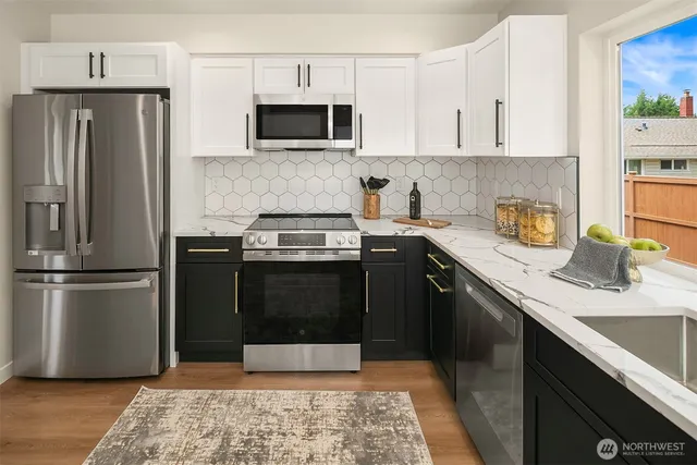 a kitchen with a sink stove and refrigerator