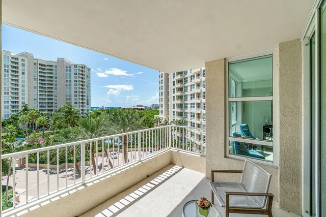 a view of a balcony with chairs