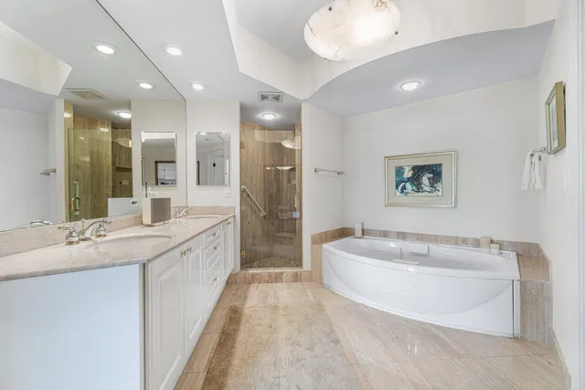 a spacious bathroom with a sink mirror and a shower