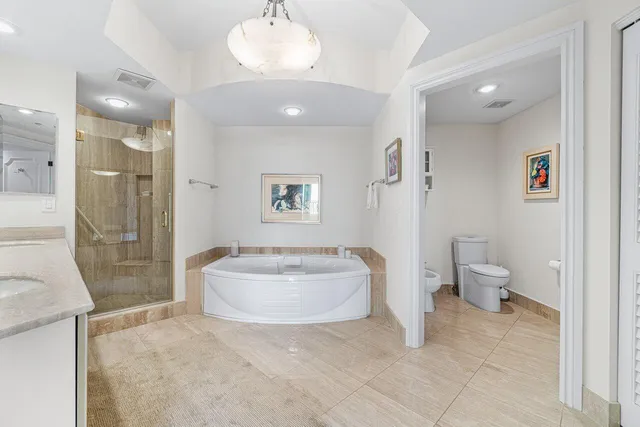 a utility room with sink dryer and washer