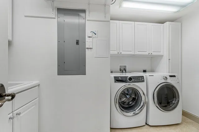 a balcony with chairs and view of living room
