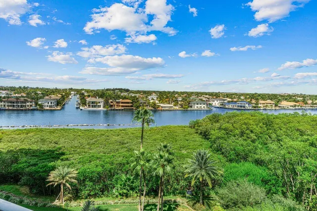 a view of a lake with houses in the back