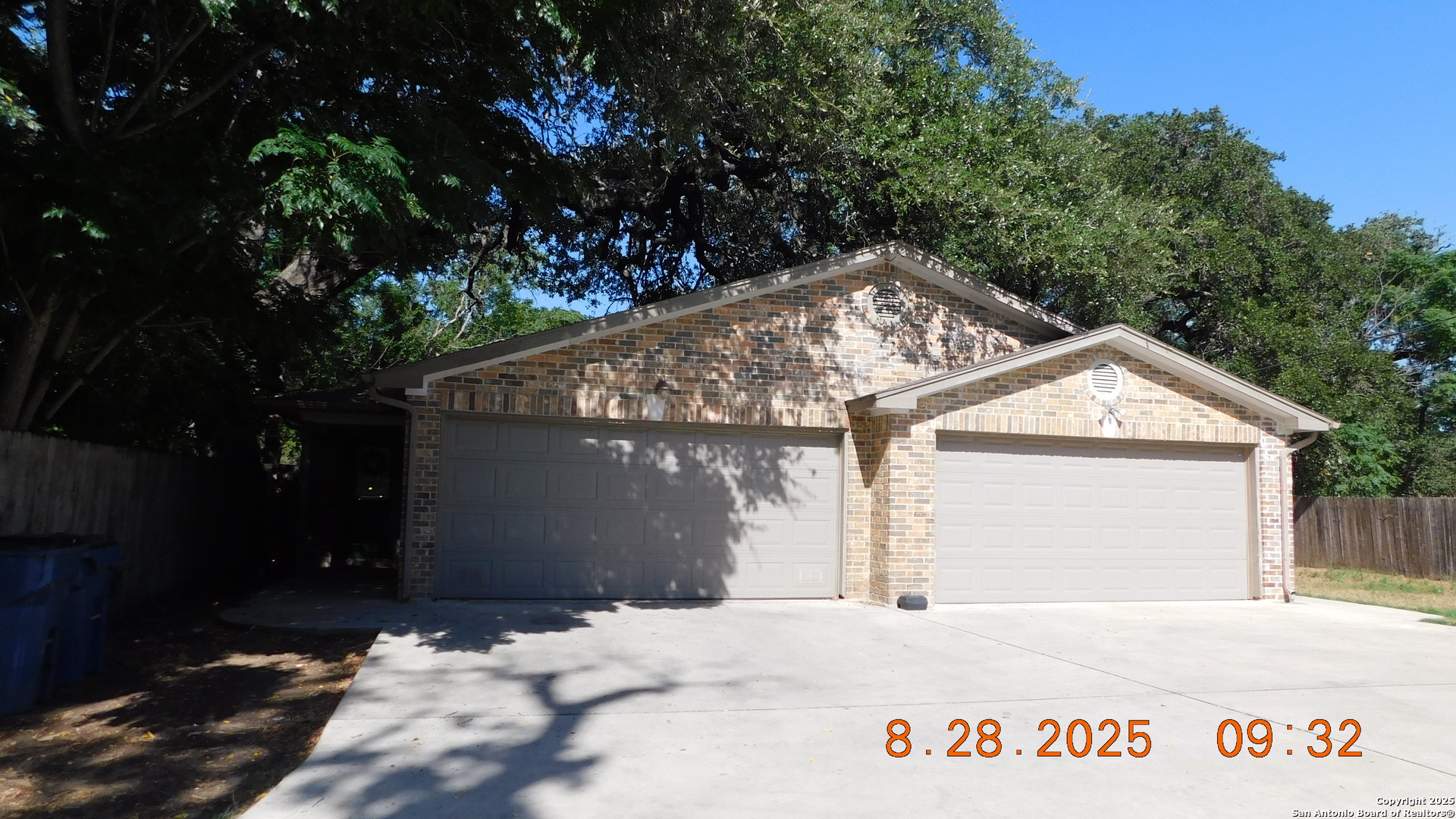 1411 Martin Street Pleasanton, TX 78064 - Photo 2 of 7 a front view of a house with a tree