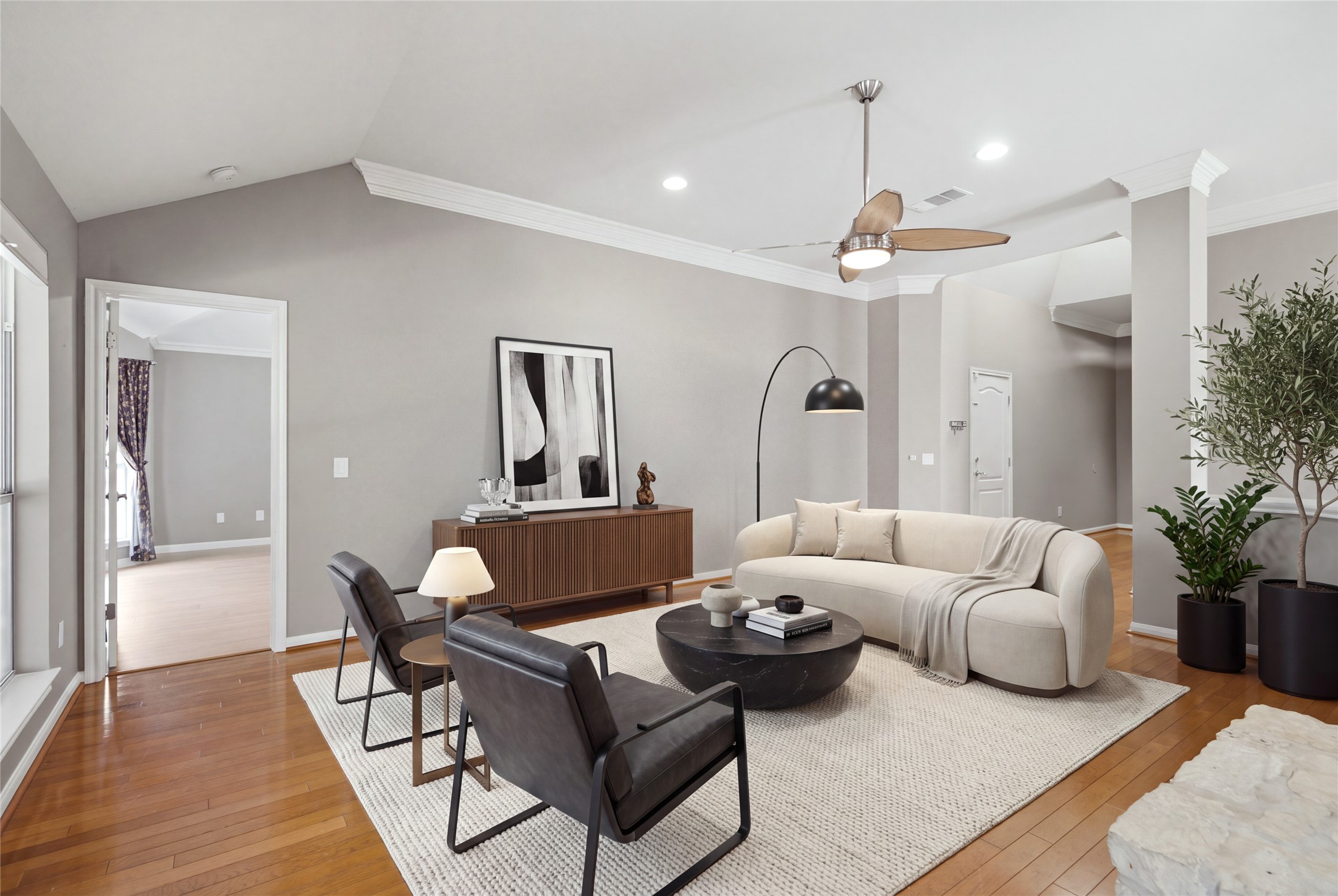 6032 Roxbury Lane Austin, TX 78739 - Photo 7 of 34 Polished hardwood flooring and elegant crown molding define this open living area.
