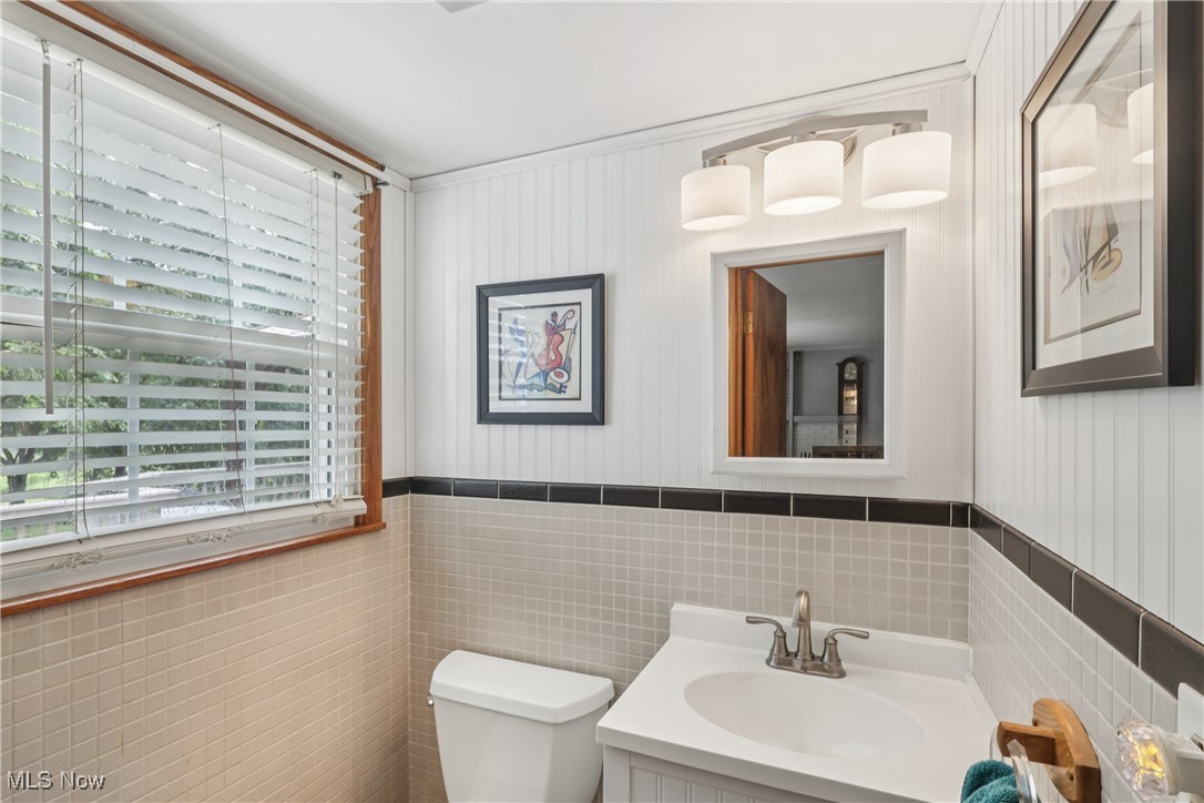 520 East Caston Road Uniontown, OH 44685 - Photo 17 of 47 First floor half bath with sink / vanity, special lighting and commode